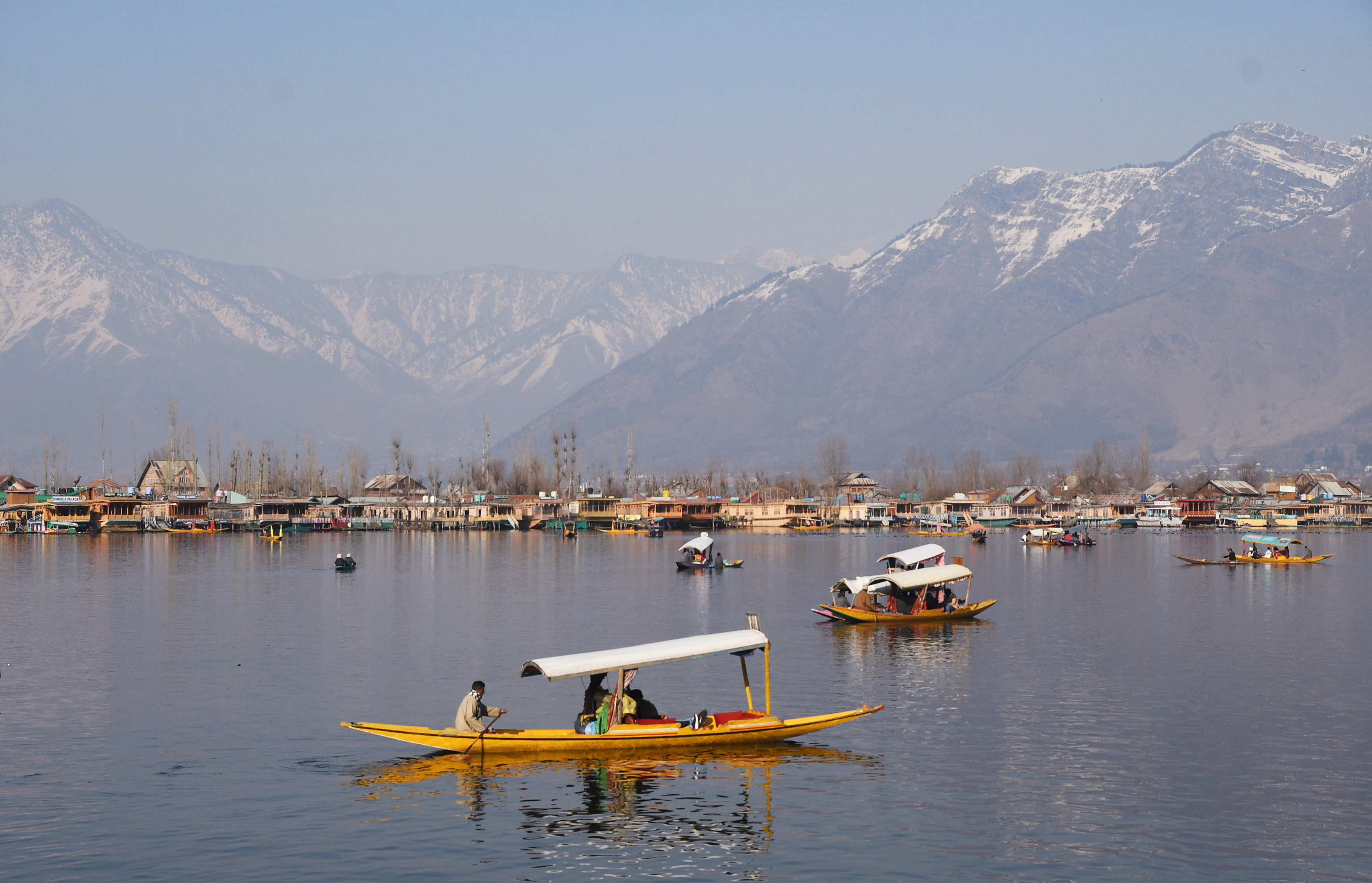 People enjoy the Shikara ride in the Dal lake in Srinagar