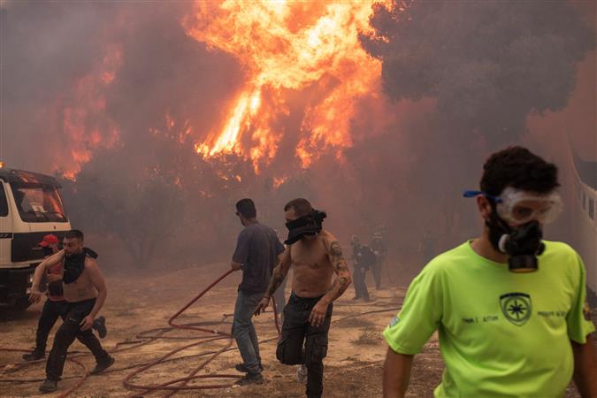 18 bodies found in Greece as firefighters battle wildfires