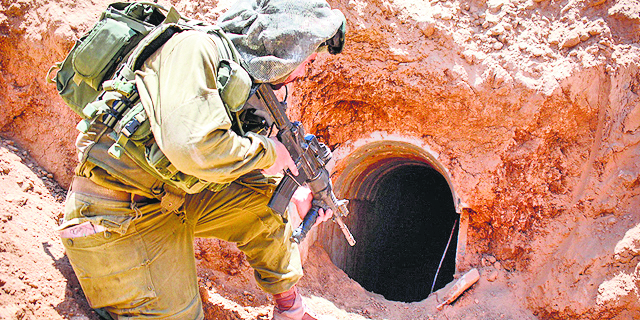 Israeli soldiers discover 35 Gaza tunnel shafts, seize weapons