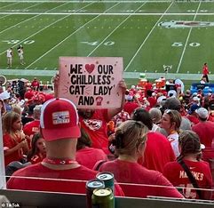 Taylor Swift’s Hilarious Reaction To Chiefs Fan’s ‘Childless Cat Lady’ Poster Goes Viral