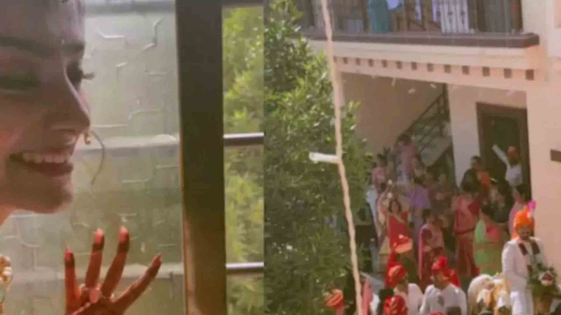 Bride Takes A Sneak Peak Of Groom Through Window | Watch