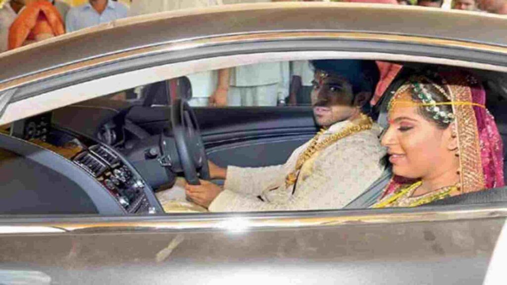 Ram Charan with his wife in Aston Martin Vantage V8 Ram Charan with his wife in Aston Martin Vantage V8