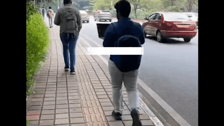 Bengaluru Man Joins Office Call On Laptop While Walking on Road | WATCH VIDEO