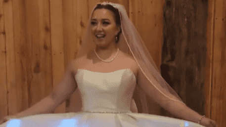 Game On! Bride Streams Oregon Football On Her Wedding Dress At Reception | WATCH