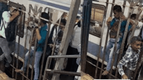 Mumbai: Passengers Squeeze Through Railings, Jugaad’ To Avoid Platform Walk | WATCH