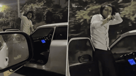 Viral ‘Chillum’ Stunt: Youth Seen Smoking Standing On Moving Car Gate In Noida | VIDEO