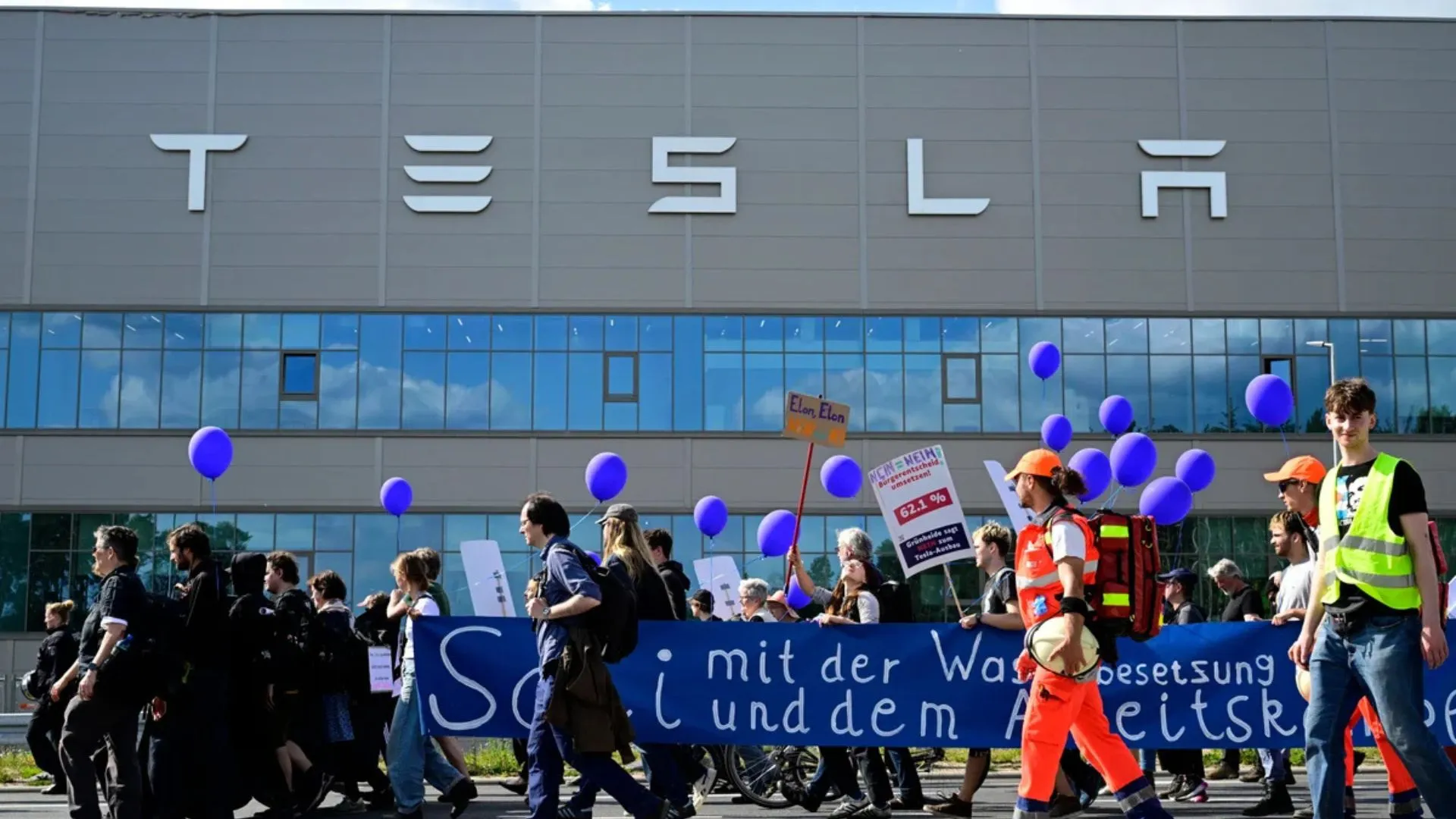 Activists Target Tesla Gigafactory with Provocative Projection Criticizing Elon Musk