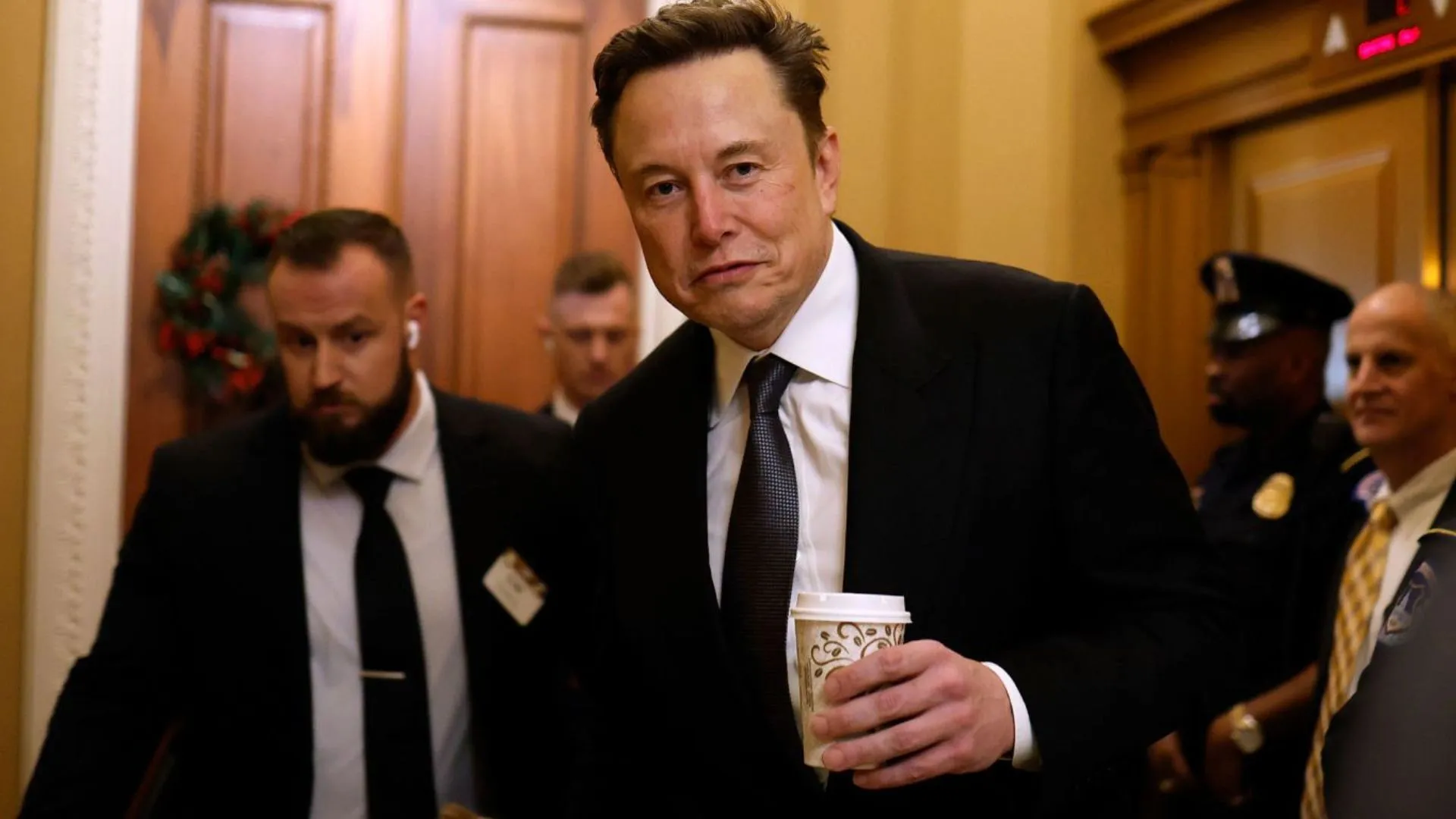 Elon Musk Jokes as ‘White House Tech Support,’ Sports ‘Tech Support’ T-Shirt at Summit