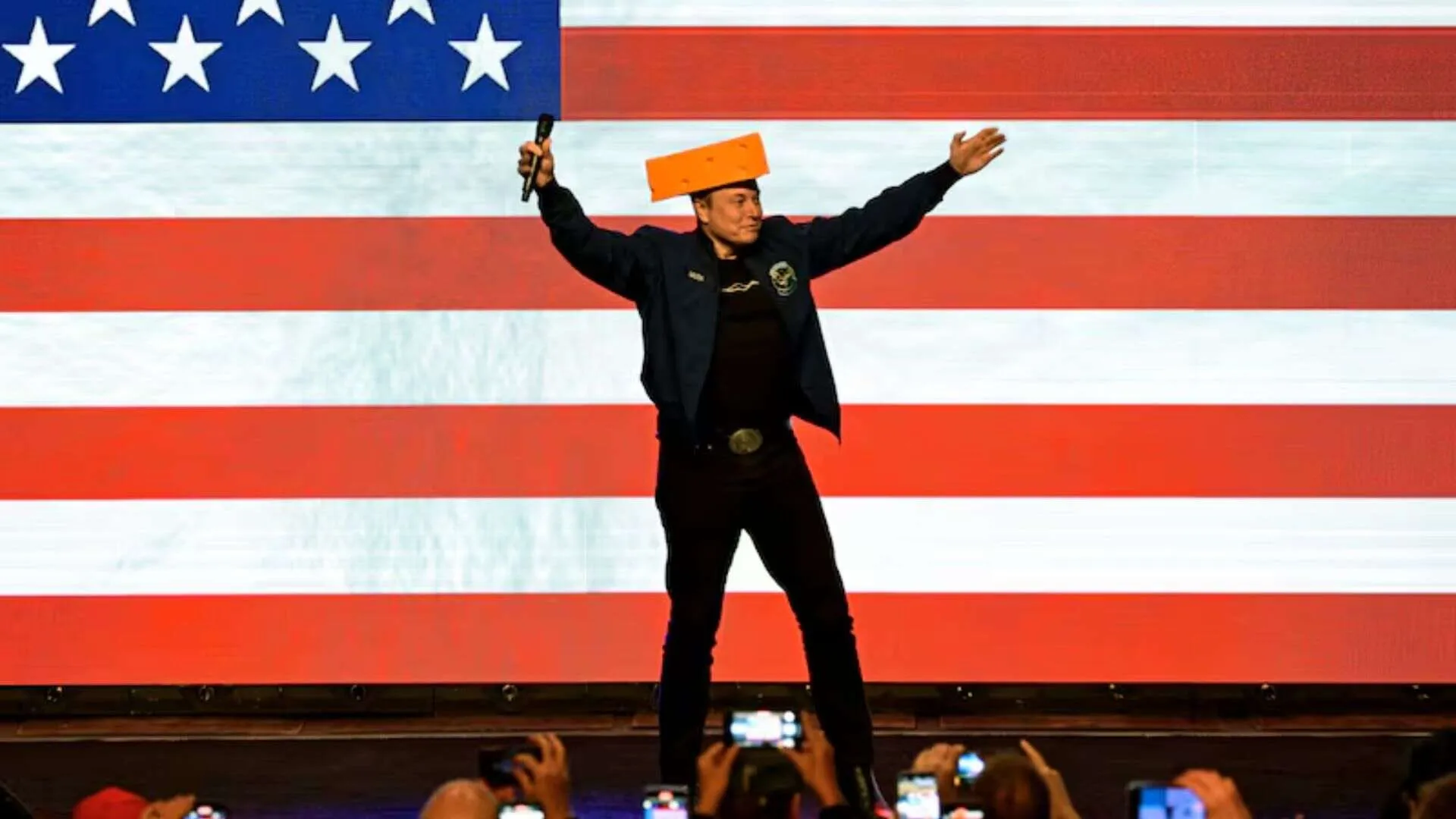Elon Musk Rocks Cheesehead Hat in Wisconsin, Tosses It to Crowd After Signing | WATCH